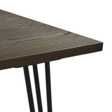 Black mat table with metal legs and wooden top .